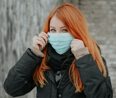 woman donning mask